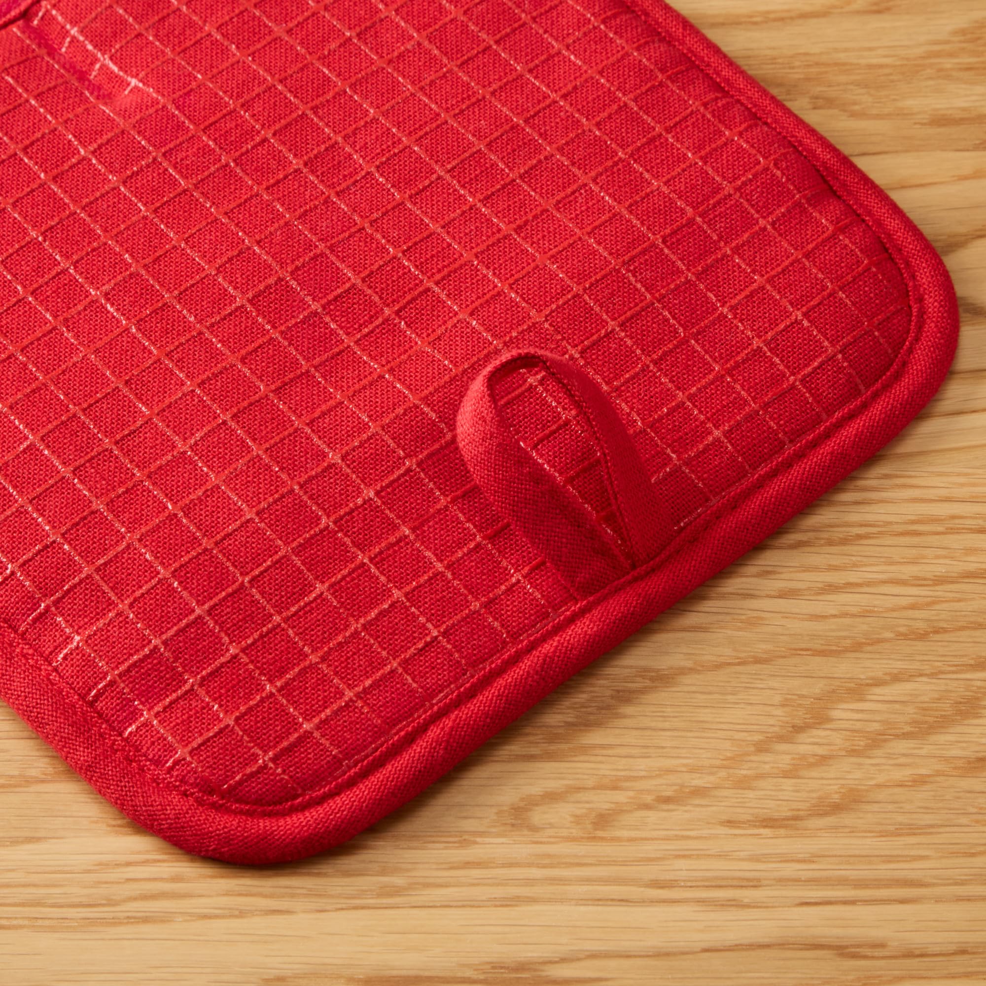 KitchenAid Gourmet Gridlines pot holder magnets and hanging loops for storage.