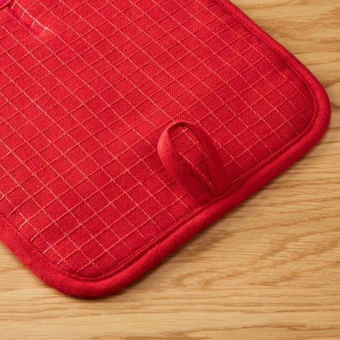 KitchenAid Gourmet Gridlines pot holder magnets and hanging loops for storage.