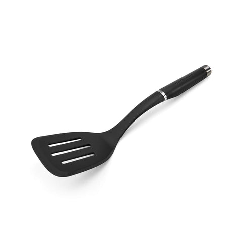 KitchenAid gourmet nylon slotted turner in black showing a wide turning surface for lifting foods safely.