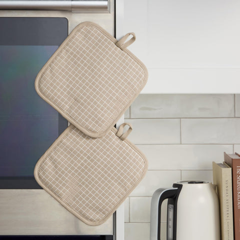 KitchenAid Gridlines pot holder featuring cotton shell and polyester lining for durability.