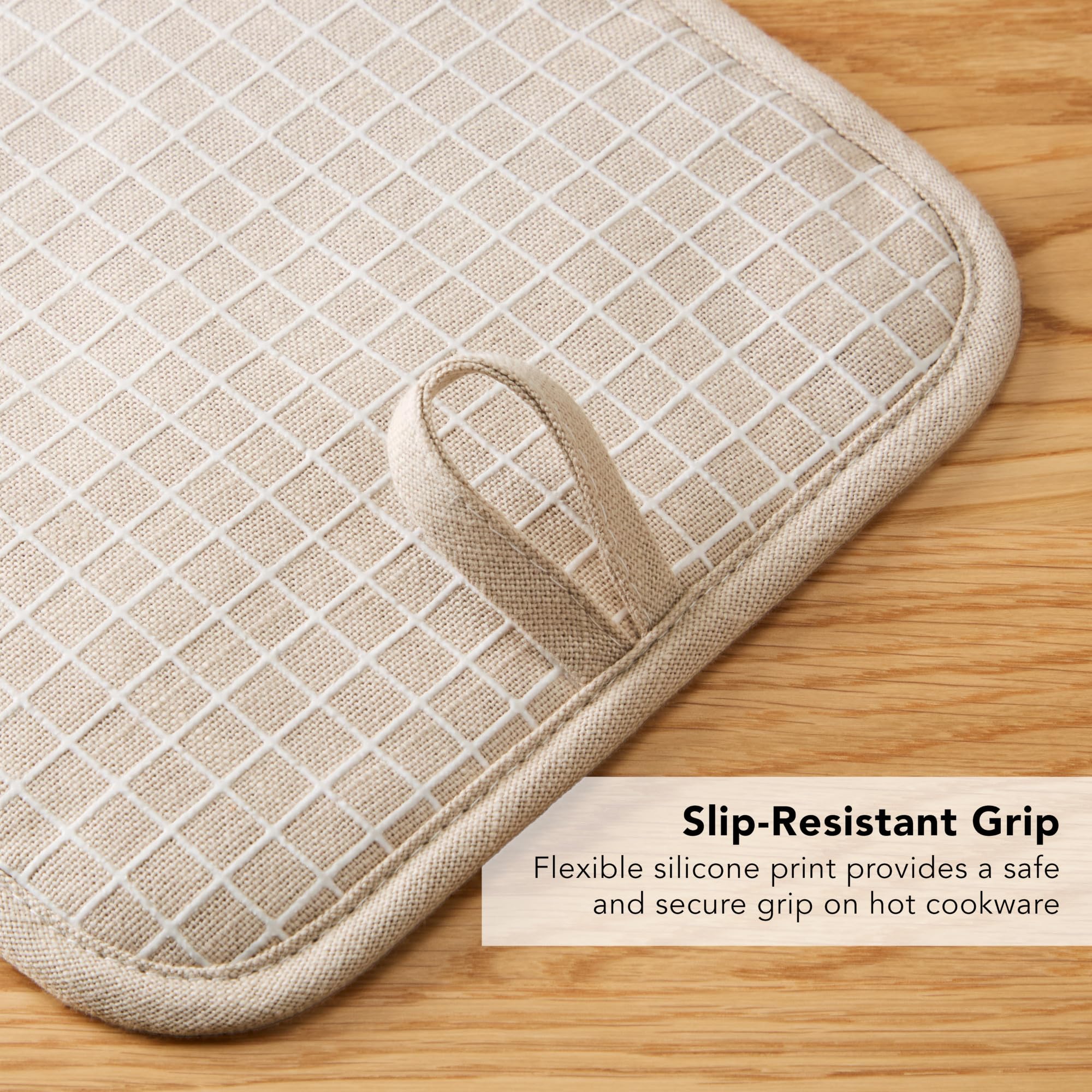 KitchenAid Gridlines pot holders with hanging loop for tidy storage.