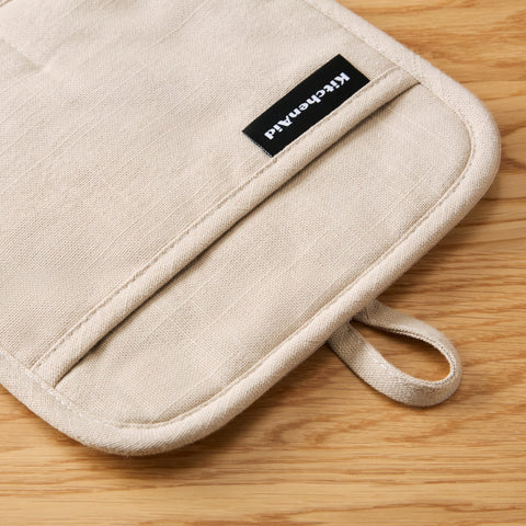 KitchenAid Gridlines pot holder with magnetic cuff for easy storage.