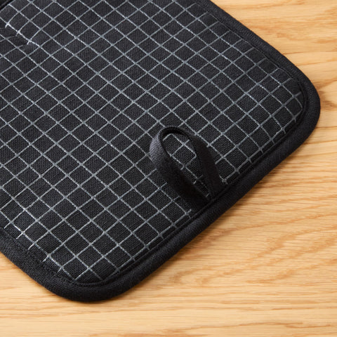 KitchenAid potholder 8x8 inch size protects hands during oven-to-pan transfers.