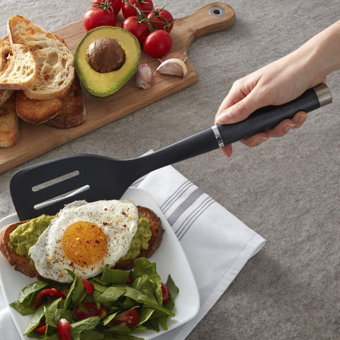 KitchenAid nylon slotted turner shown as dishwasher safe for quick cleanup.