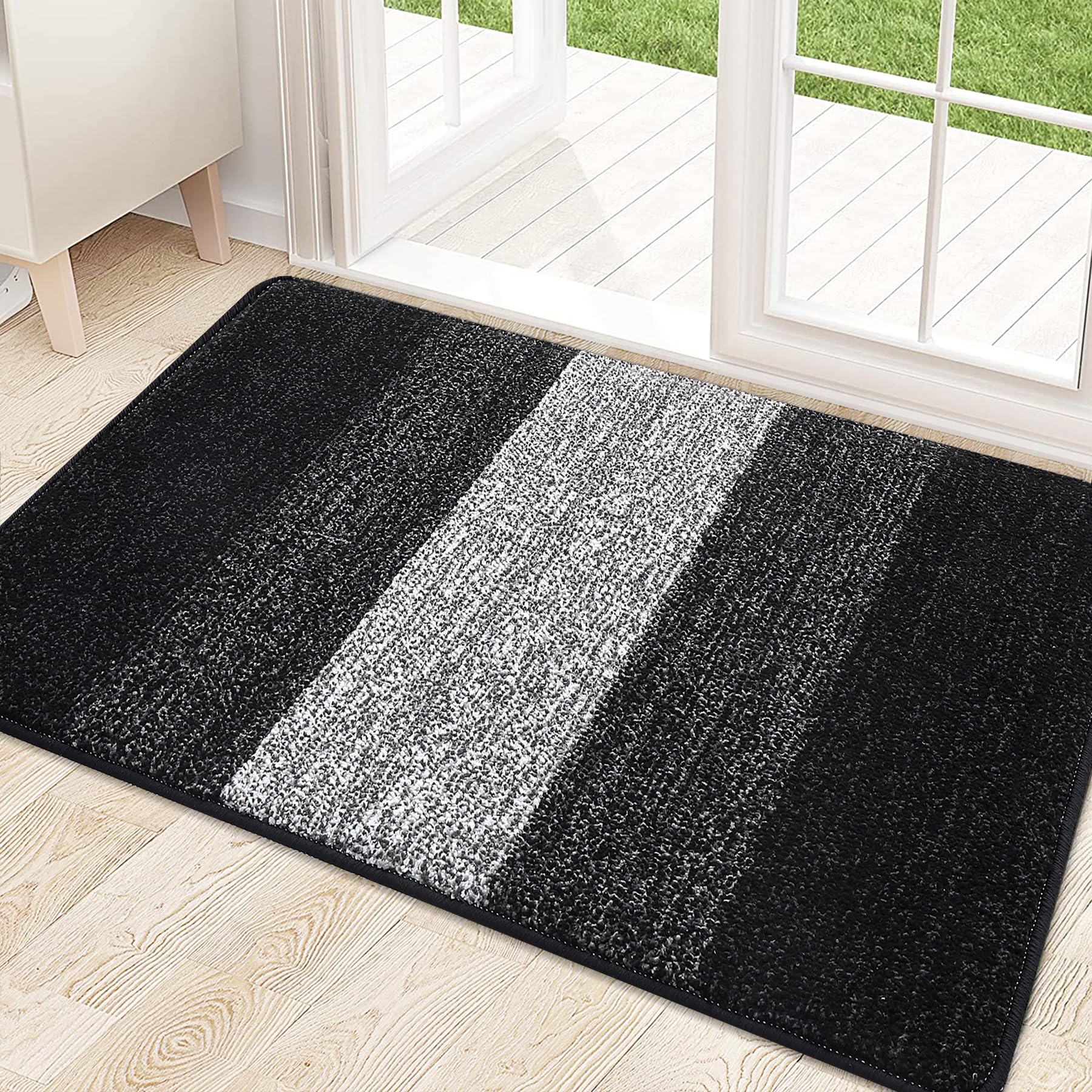Kitinjoy front door mat absorbs moisture and dirt at the threshold.