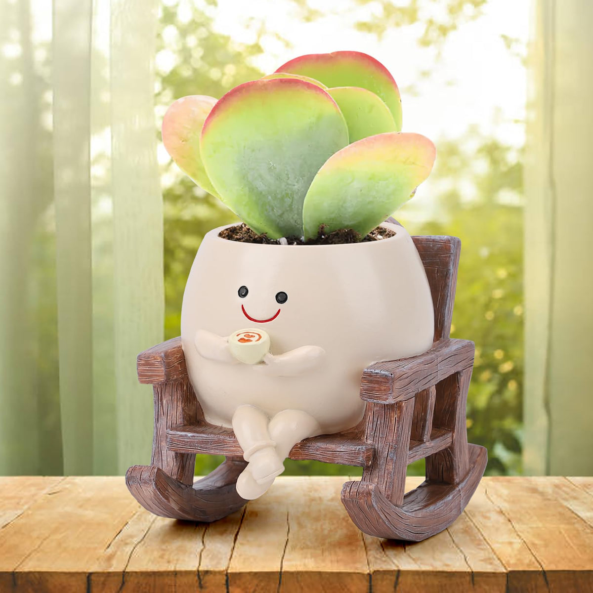 KIUGCO Smily Face rocking chair planter on a sunny indoor shelf, adding whimsy to decor