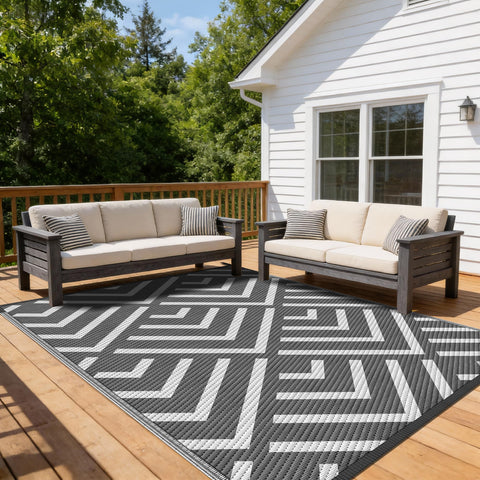 Kohree outdoor rug 9x12 reversible gray and white on patio offering a durable waterproof surface.