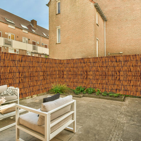 KOIUEYW reed fence privacy shading about 70 percent for sunny days.
