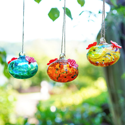KRISININE glass feeders as charming garden decor on windows or walls.