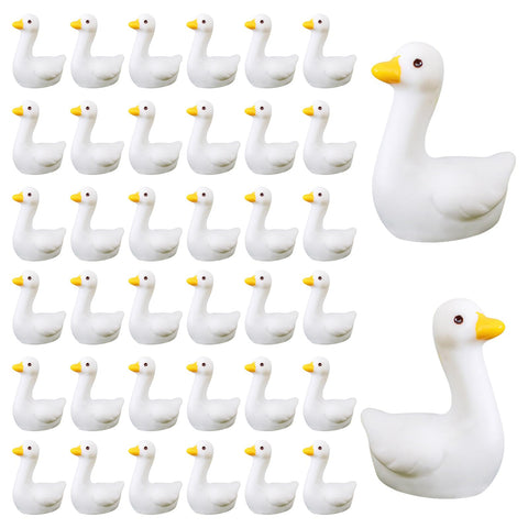 Ksheria mini goose figurine with glossy white body for desk decor and whimsy