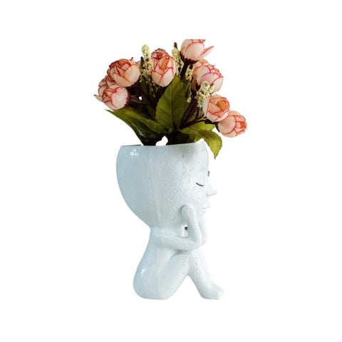 Kudriod indoor-outdoor face planter suitable for both patio and desk setups.