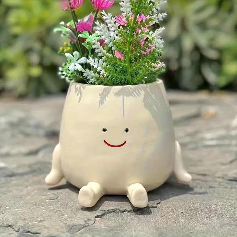 Kudriod Smiley Face Planter on outdoor patio with greenery for outdoor decor