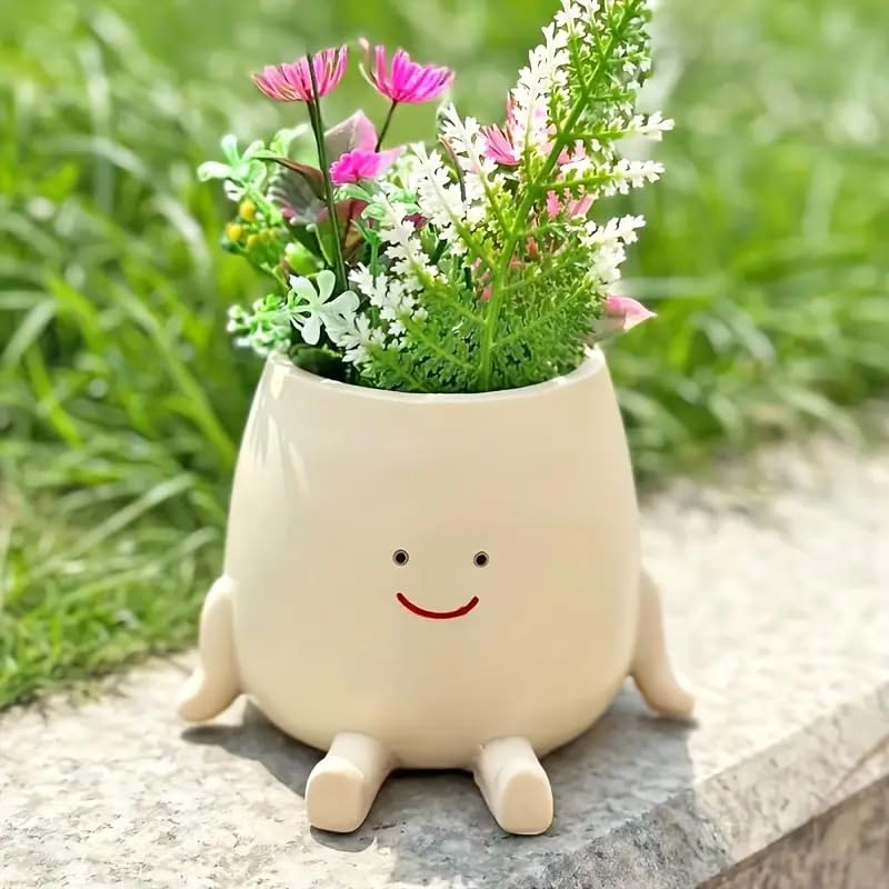 Kudriod Smiley Face Planter on a windowsill adds sunlight and greenery