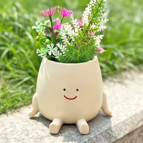 Kudriod Smiley Face Planter on a windowsill adds sunlight and greenery