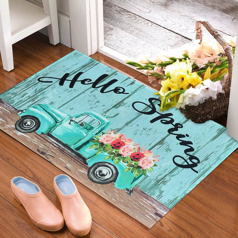 Kukli Kitchen Spring Door Mat with floral truck welcomes guests at the entry, indoor-outdoor use.