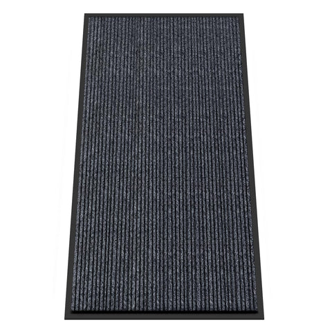 Kuyal front door mat close-up texture showing a durable surface that traps dirt.