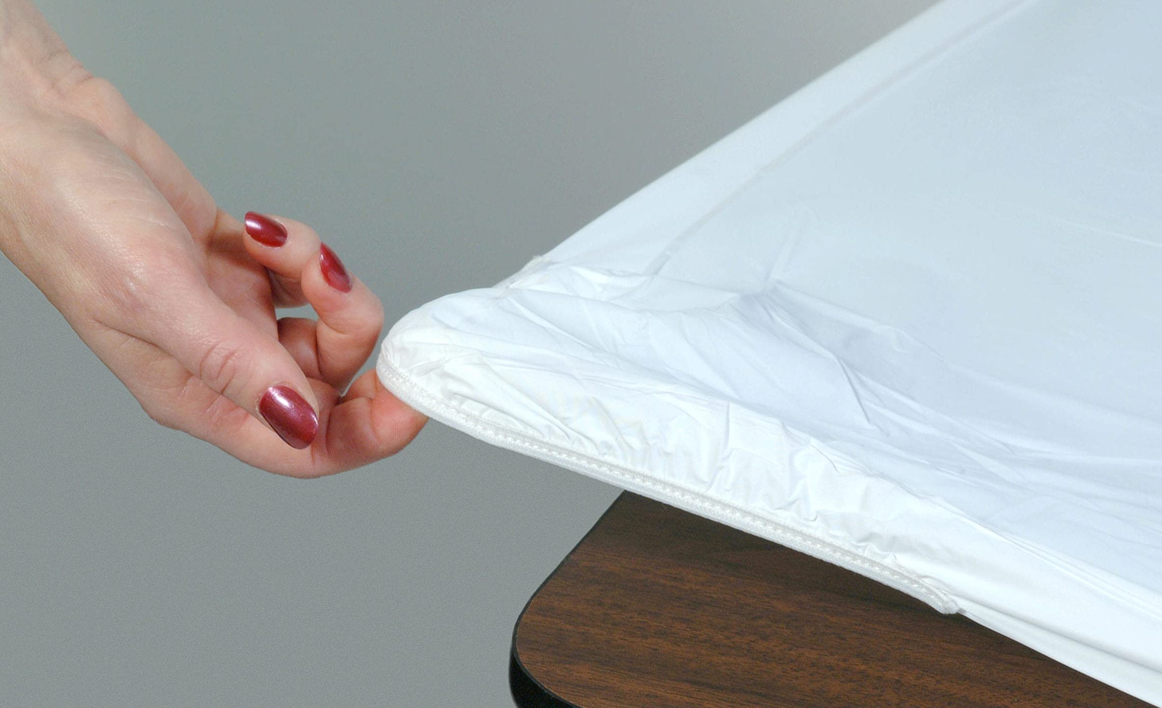 Kwik-Covers 6ft rectangle table cover in white on table for quick setup.
