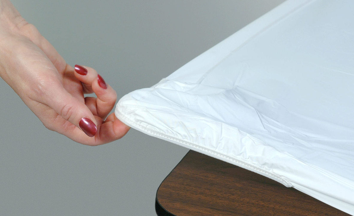 Kwik-Covers 6ft rectangle table cover in white on table for quick setup.