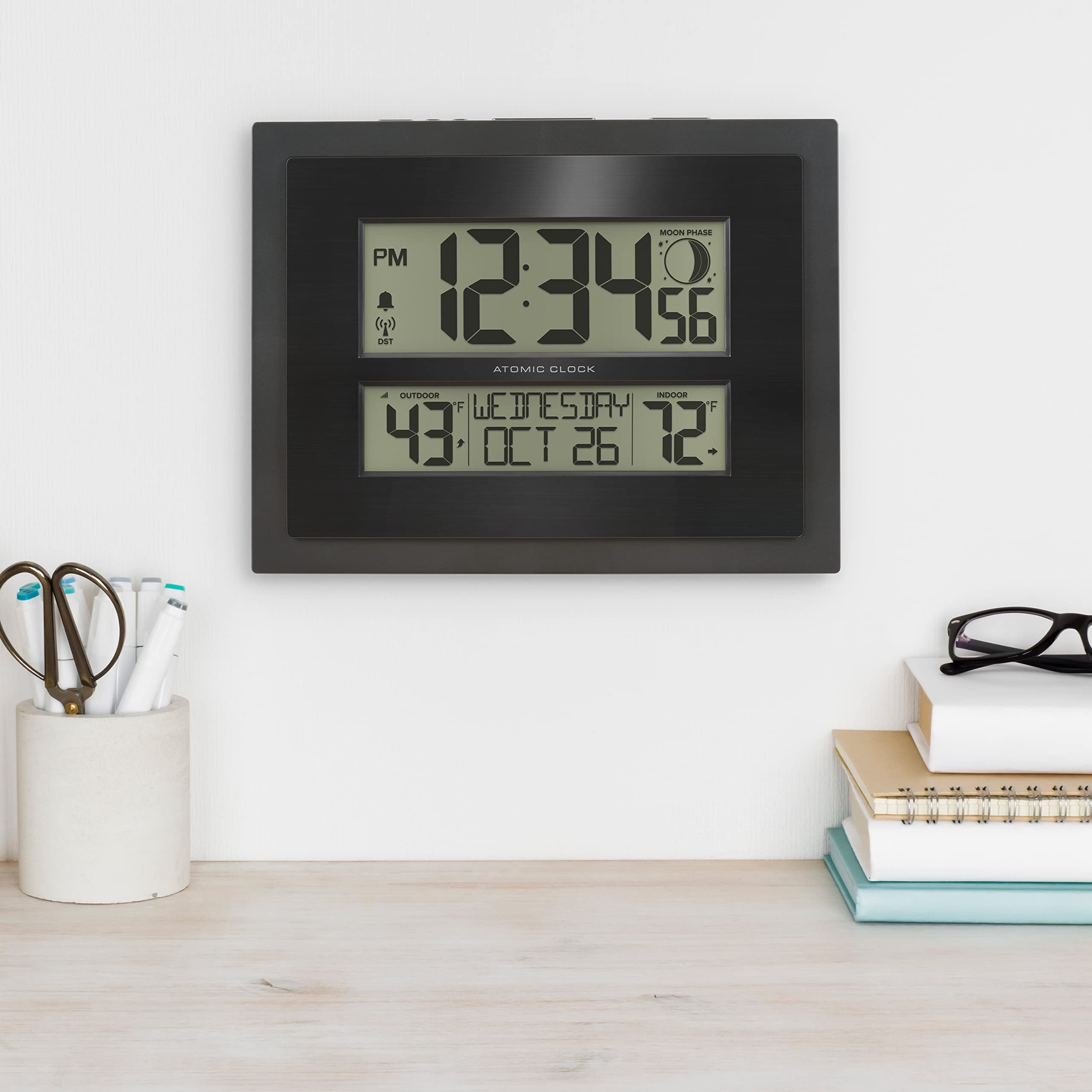 La Crosse clock shows low battery indicators for reliability.
