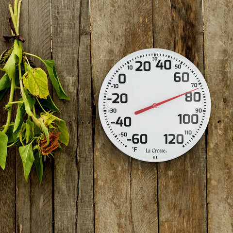 La Crosse white frame thermometer adds functional decor outdoors.