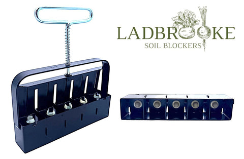 Ladbrooke Mini 5 ejection handle releasing a soil block for easy transplanting