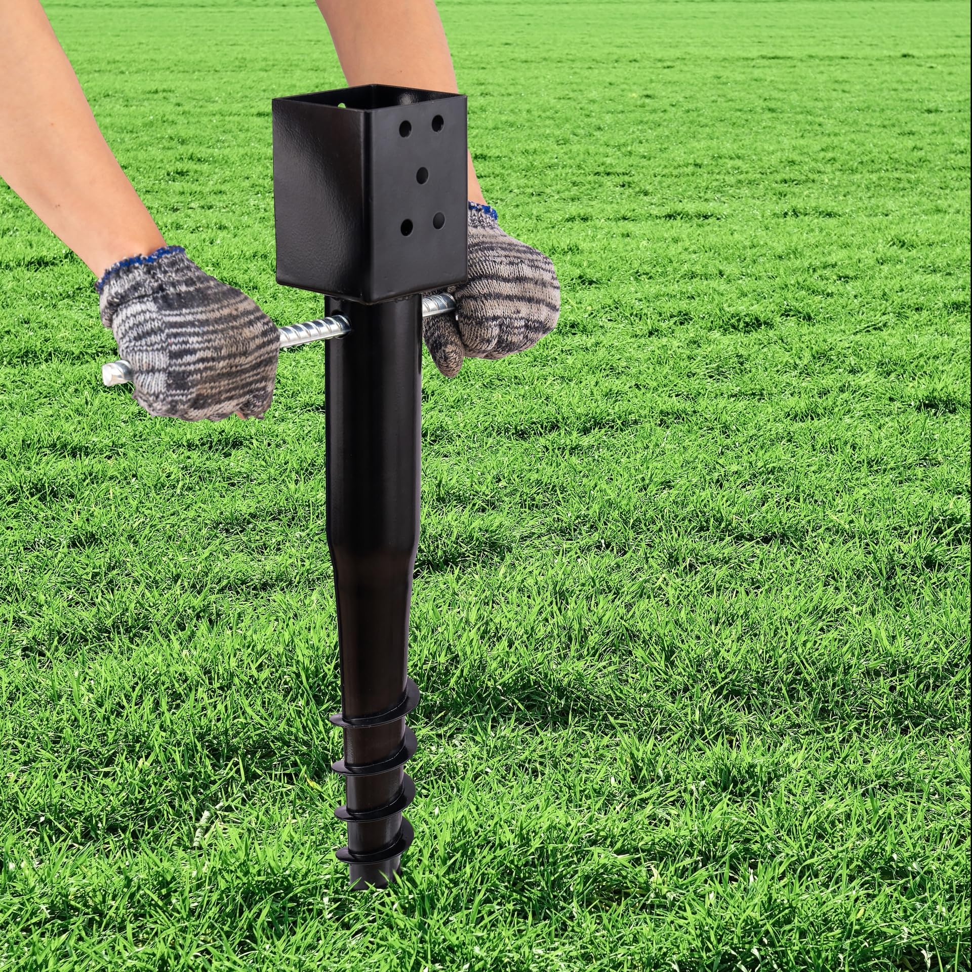 27-inch LADECH anchor being screwed into the ground for secure hold.