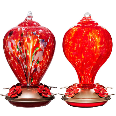 LaElvish Garden hummingbird feeder glass shines in sun, adding color to outdoor space.