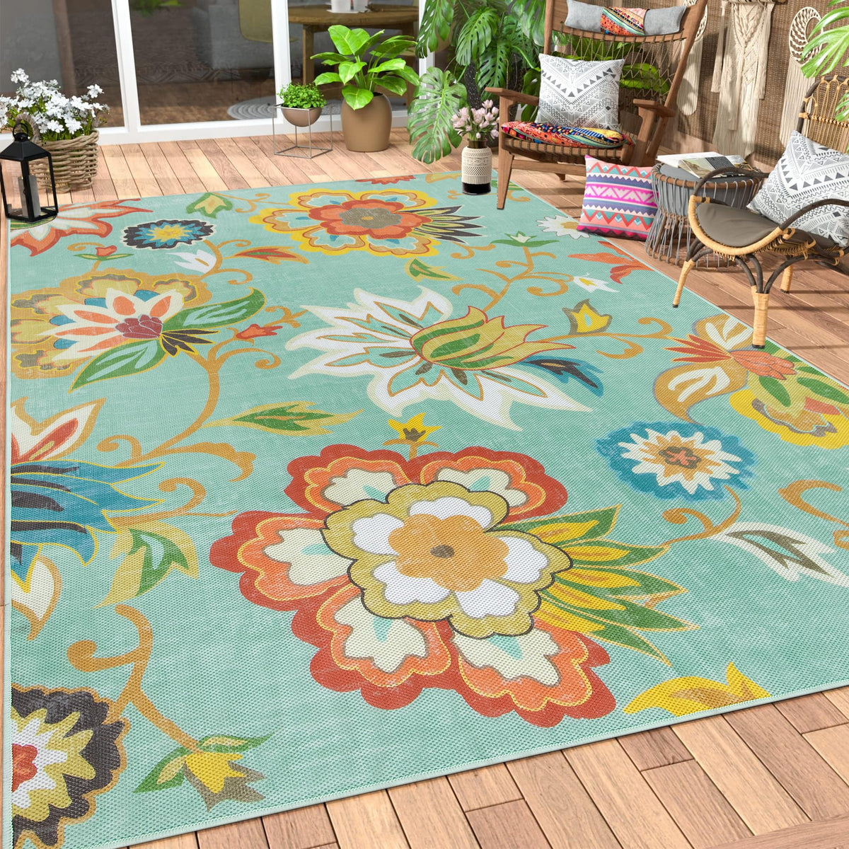 Lahome Floral Outdoor Rug 6x9ft on patio adds color and comfort.