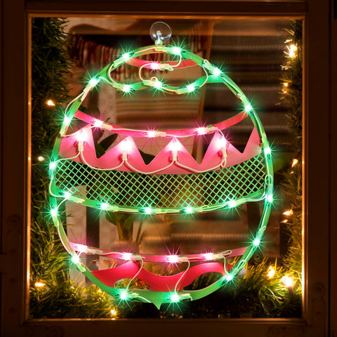 LAMPHOME Easter egg window silhouette in green with pink chevron for festive curb appeal.