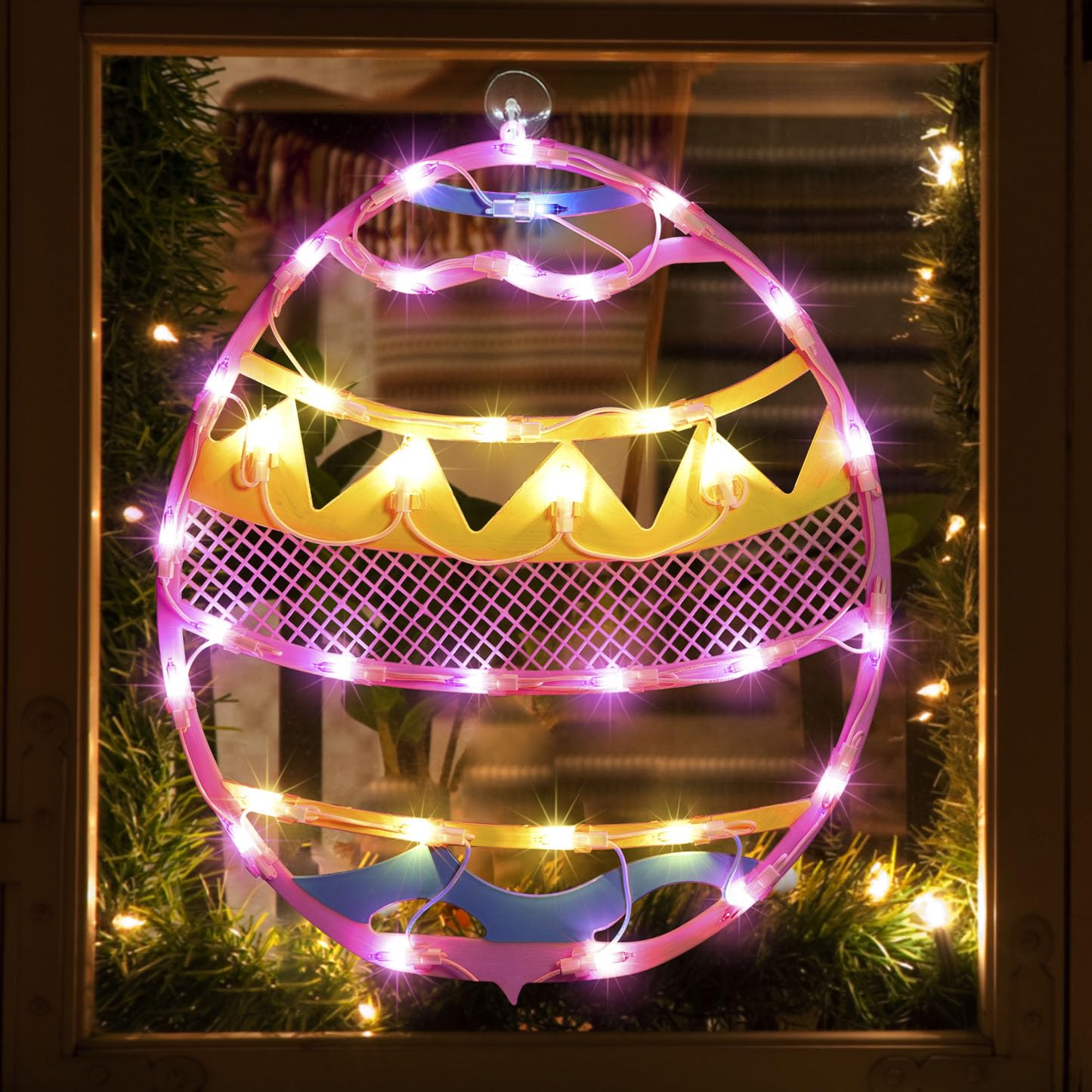 LAMPHOME pink Easter egg window silhouette adds festive curb appeal.
