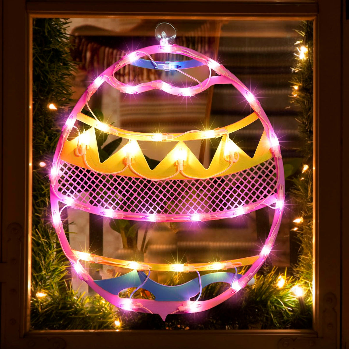 LAMPHOME pink Easter egg window silhouette adds festive curb appeal.