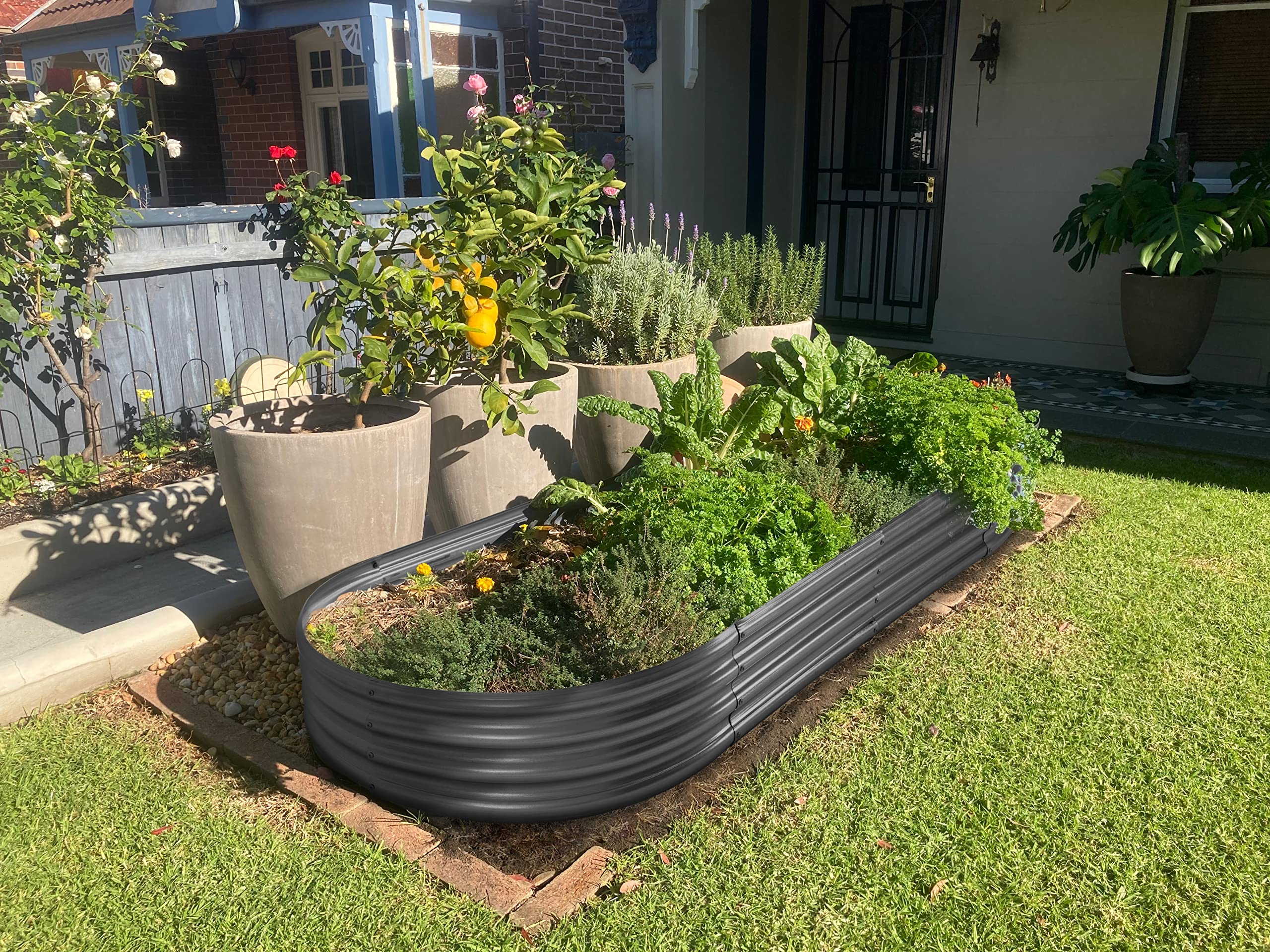 Land Guard outdoor metal bed suitable for vegetables, fruits, and herbs in yards.