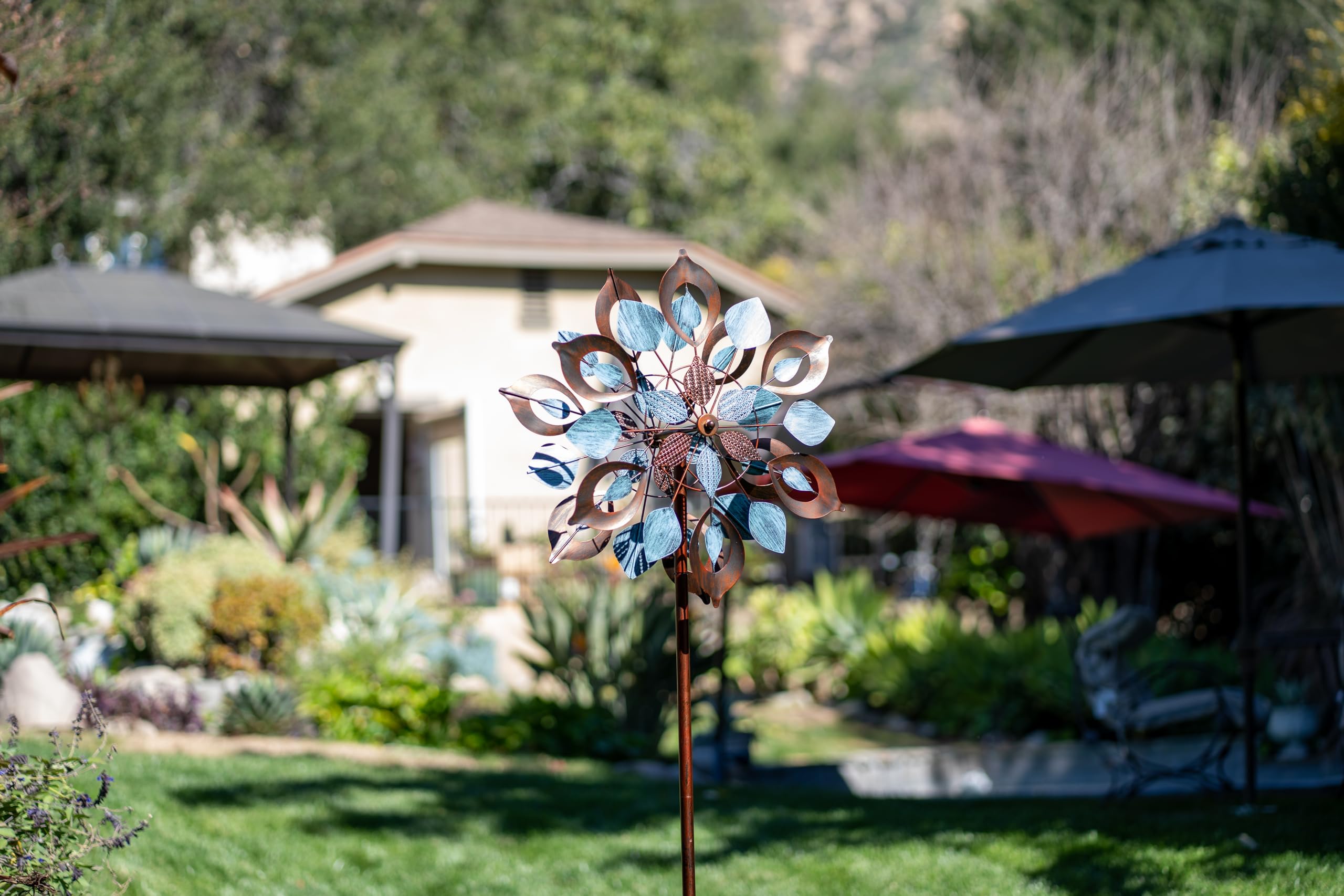 Lariander garden art wind spinner makes a striking gift for outdoor spaces.