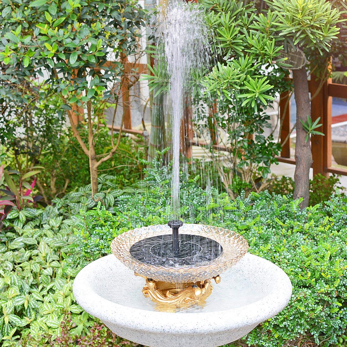 LAWOHO solar fountain with four spray heads creating varied water patterns