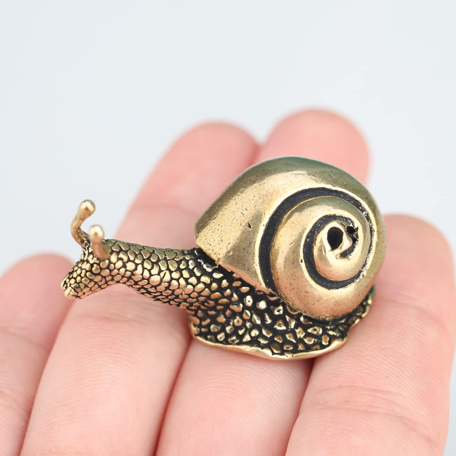 LCCCK brass snail figurine on desk adds tranquility and a touch of nature-inspired elegance.