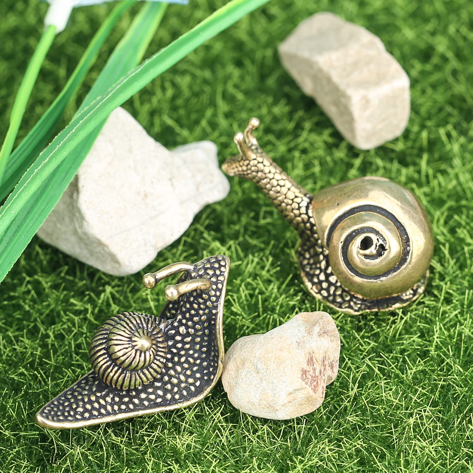 LCCCK brass snail figurine duo adds character to bookshelves or coffee tables.