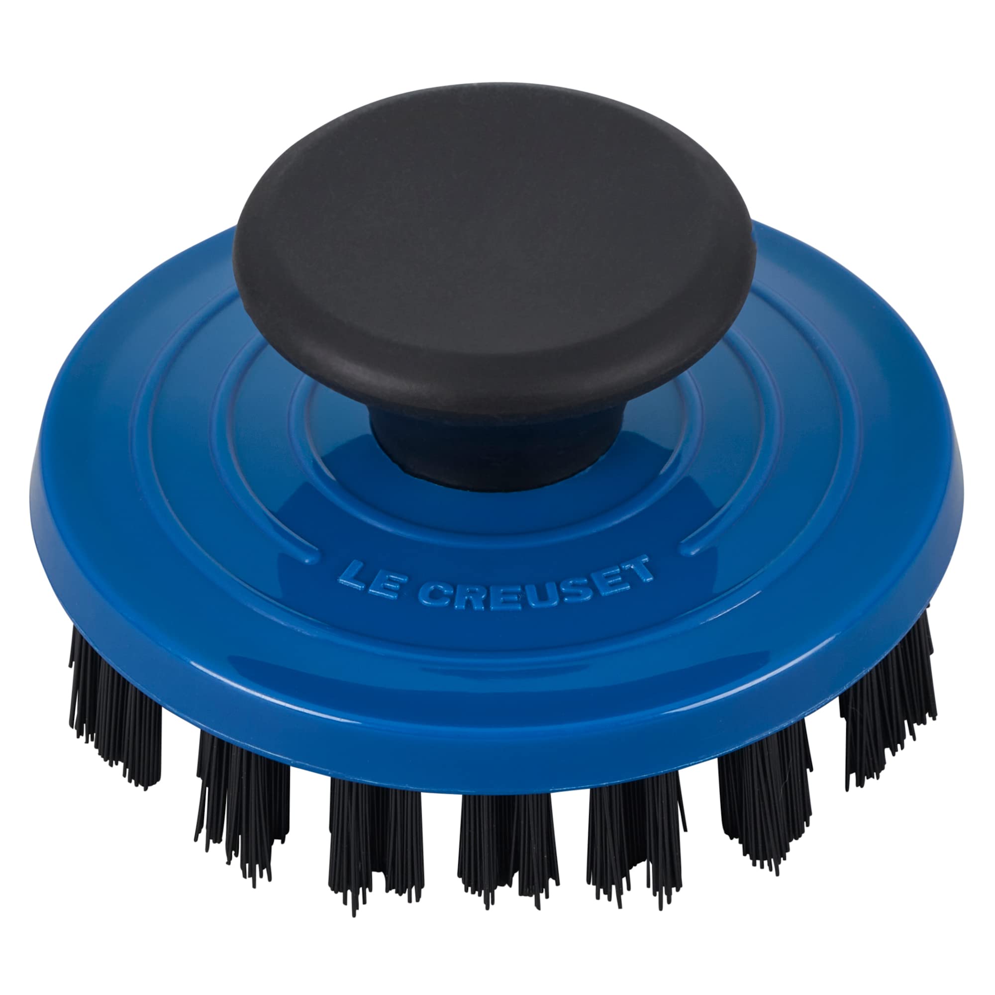 Le Creuset grill pan brush reaches between ridges for thorough cleaning.