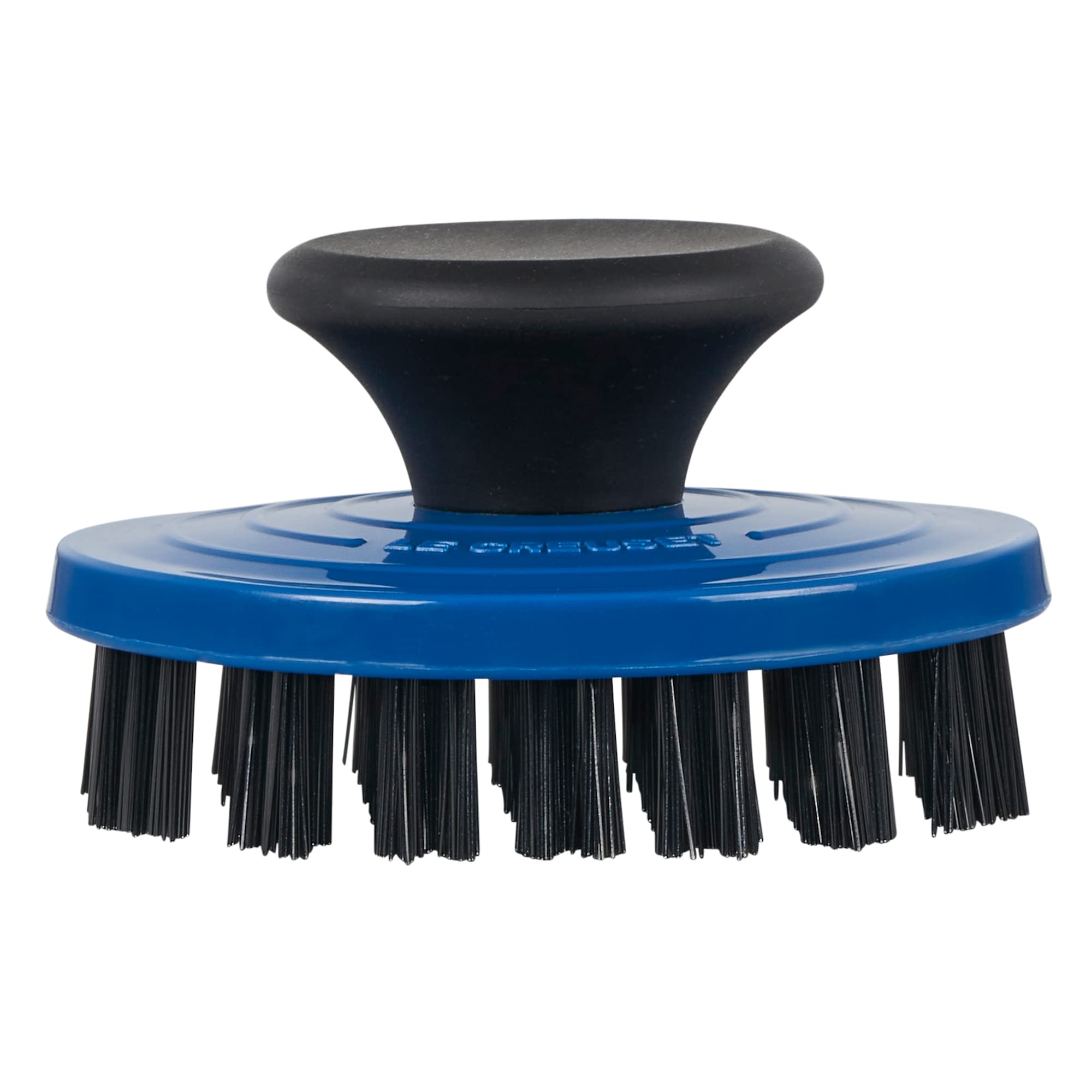 Le Creuset grill pan brush with nylon bristles cleans enameled surfaces safely.
