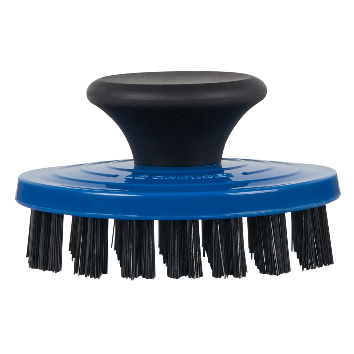 Le Creuset grill pan brush with nylon bristles cleans enameled surfaces safely.
