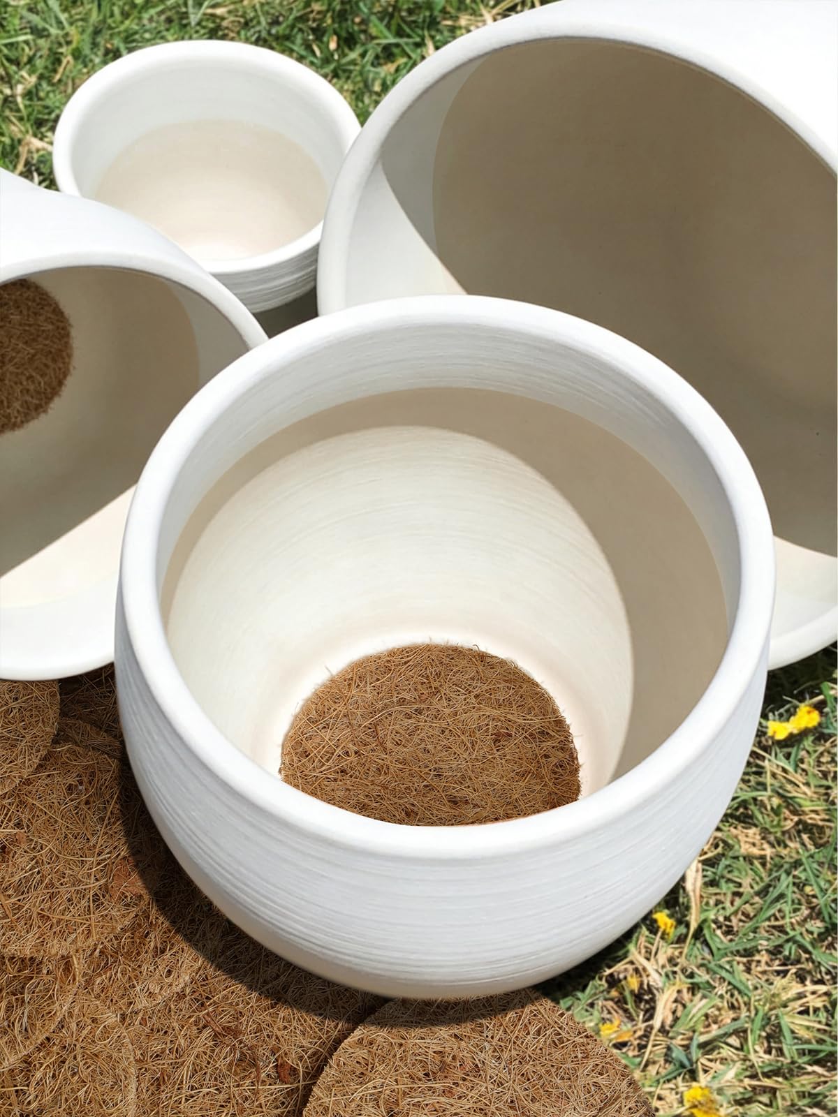 LE TAUCI coir pad installation over a planter hole is simple.