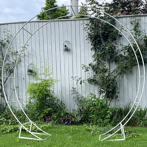 Garden-use arch with climbing plants over LeJoy Garden.