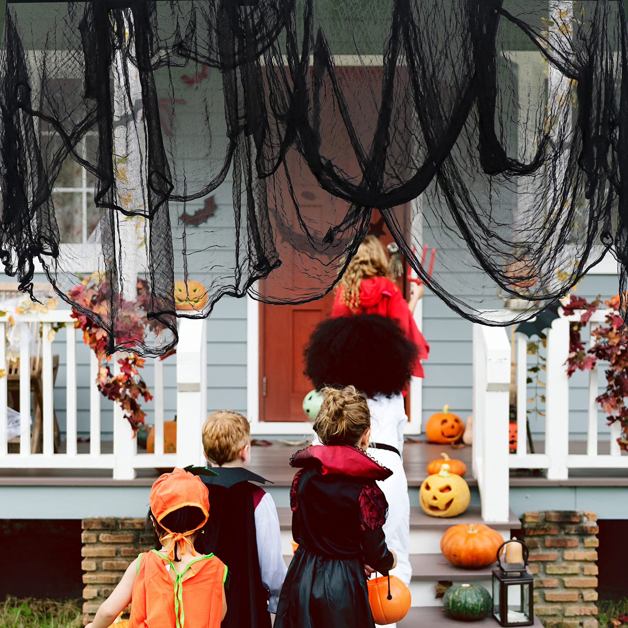 LessMo creepy cloth on windows creates a spooky ambiance.