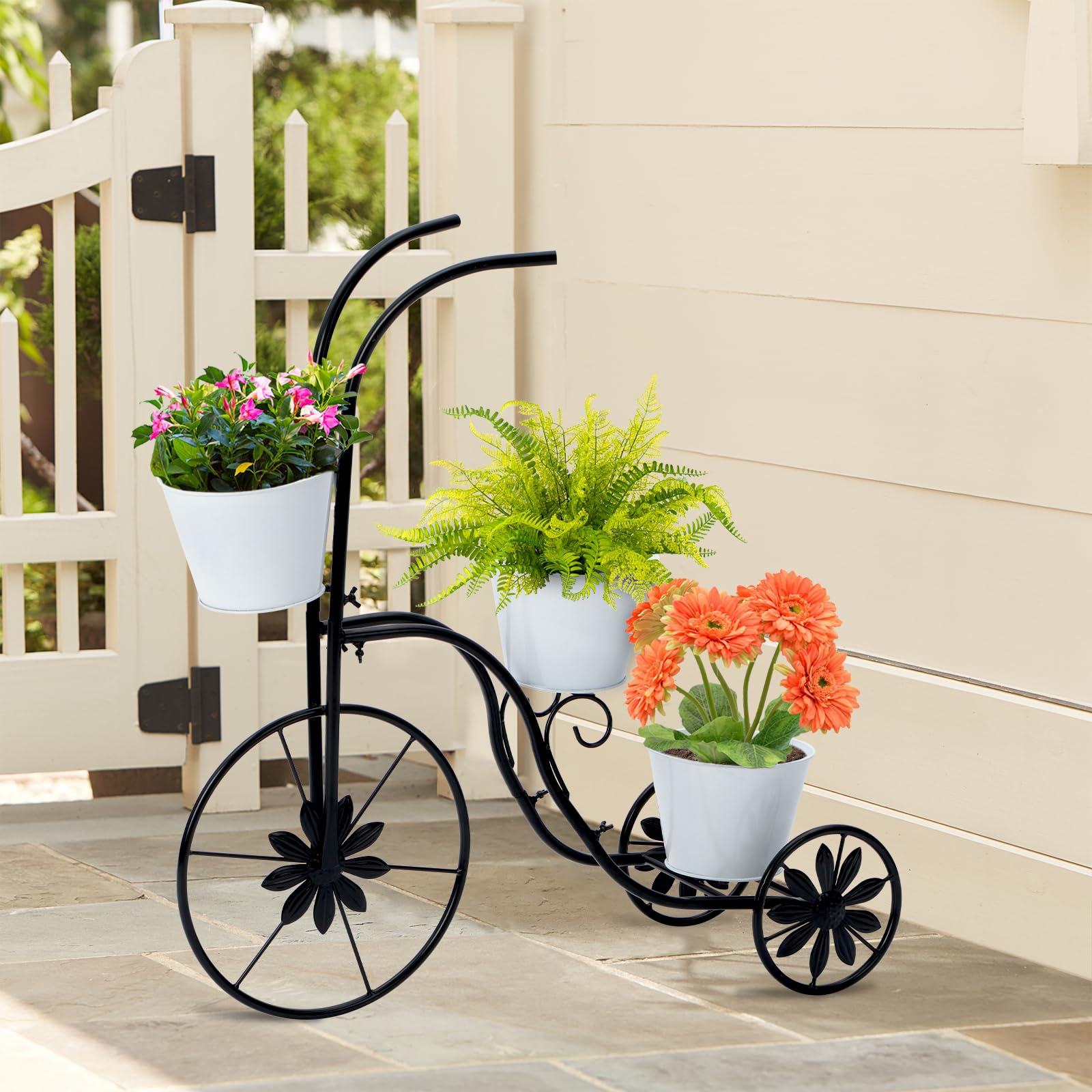 Close-up of tricycle planter wheels showing sturdy outdoor stand