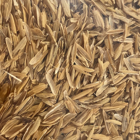 Life Cycle Organics Rice Hulls pour scene showing aeration in potted plants.