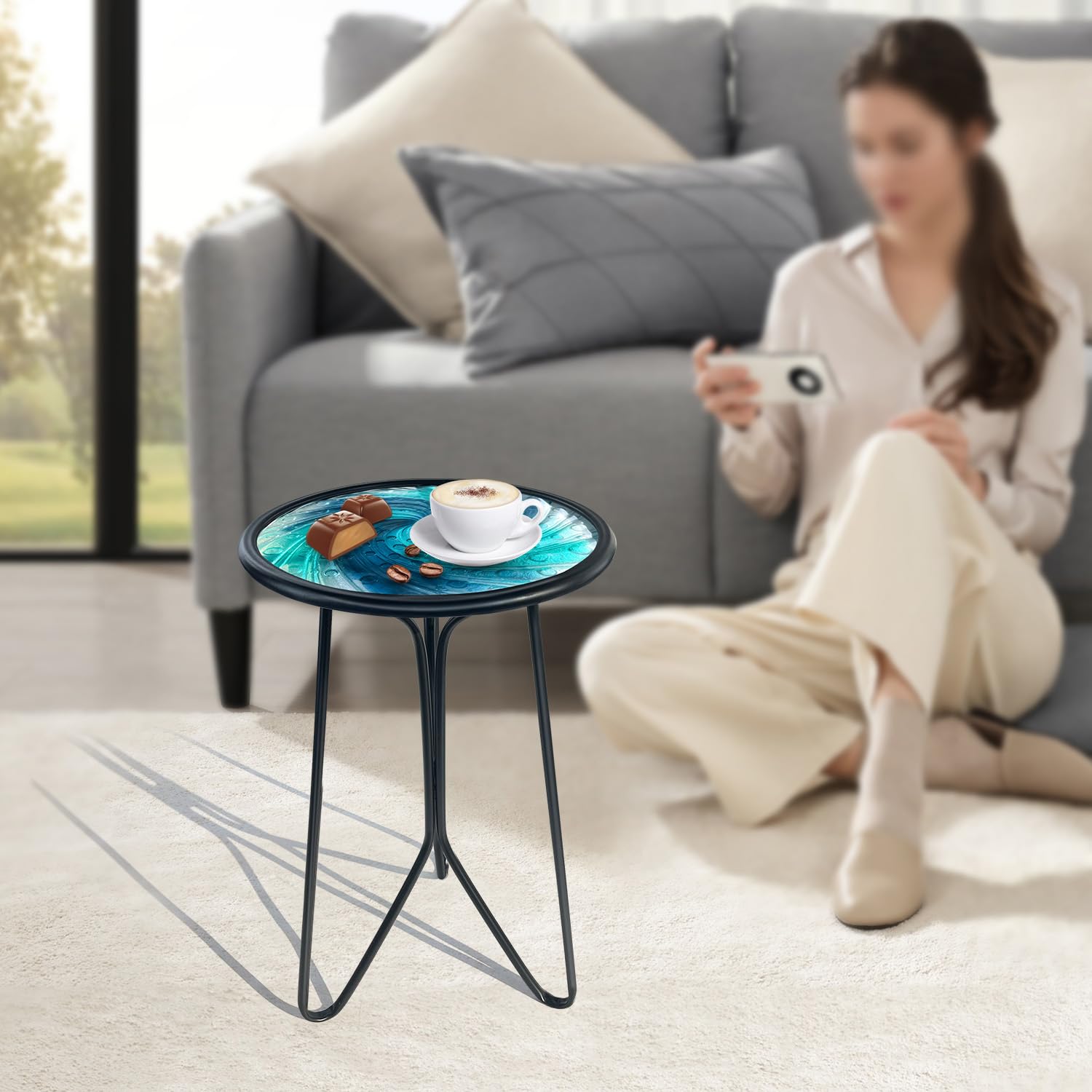 LIFFY round metal end table with a stable triangular frame for secure placement.