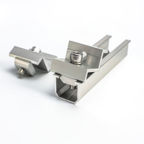 Link Solar end clamps stabilizing edge panels for a tight solar array