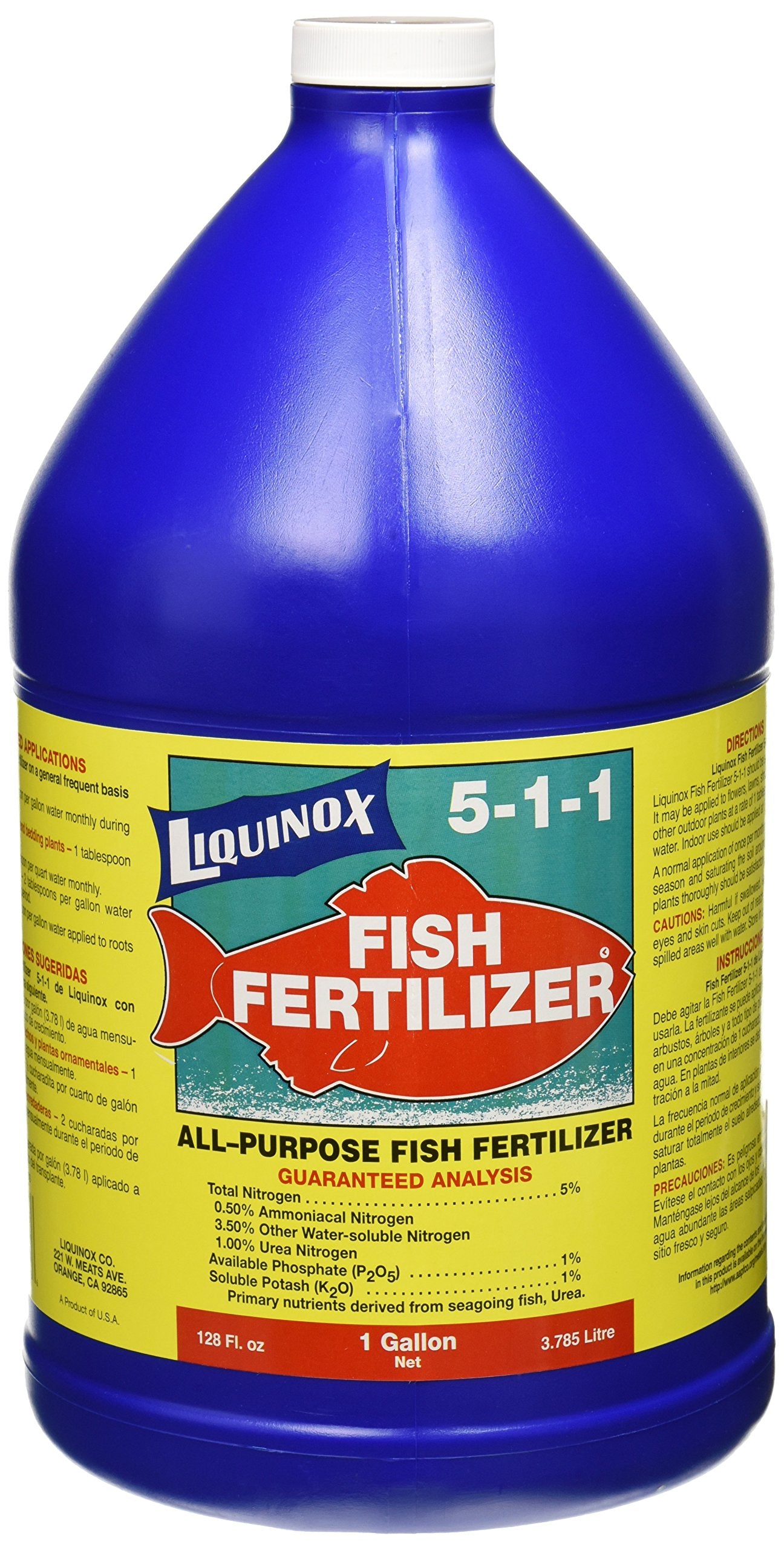 Liquinox fish emulsion bottle pouring onto a garden bed to support growth