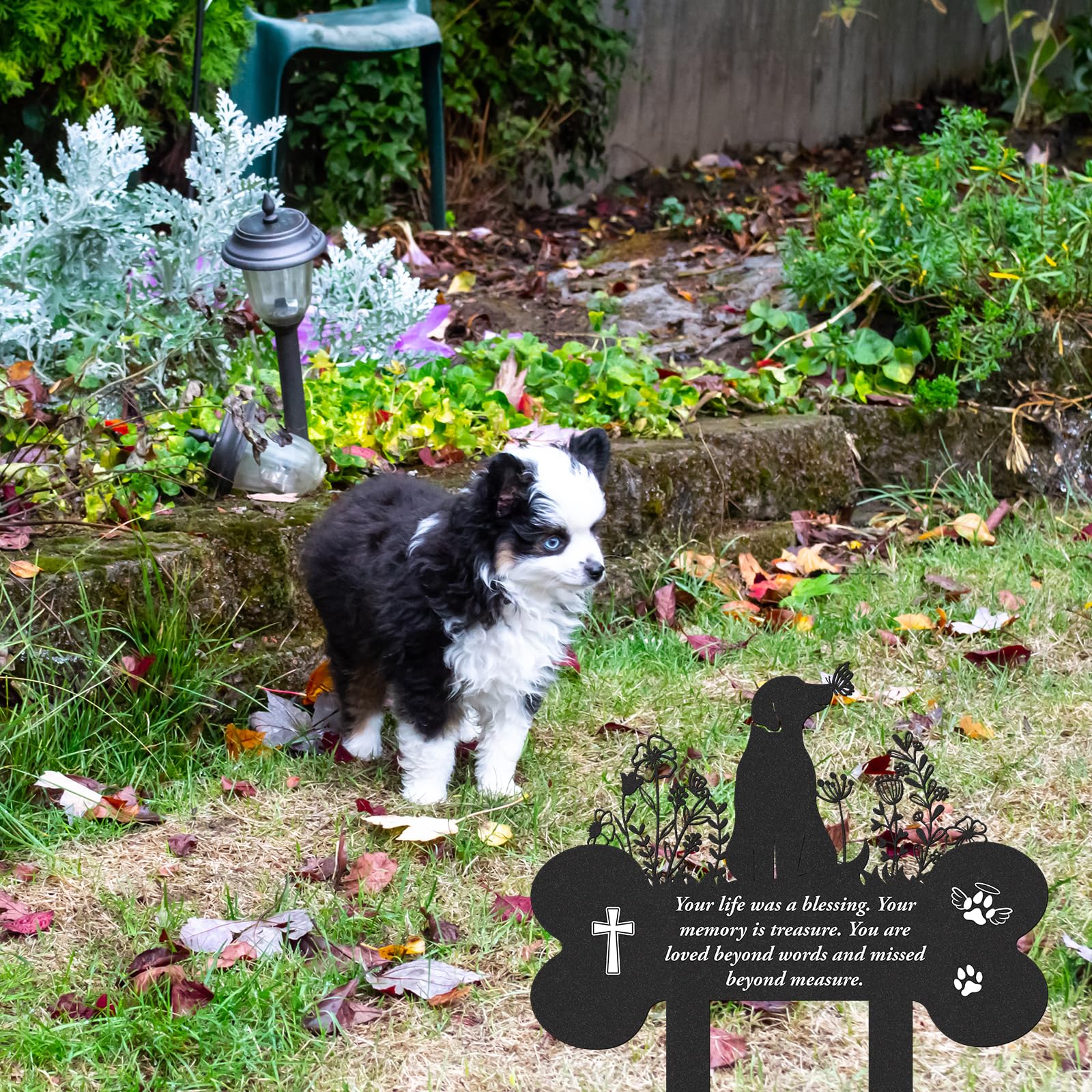 LIRAVENO dog and butterfly remembrance stake in a lawn space