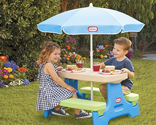 Little Tikes Easy Store Jr. Picnic Table folded for compact storage after use.
