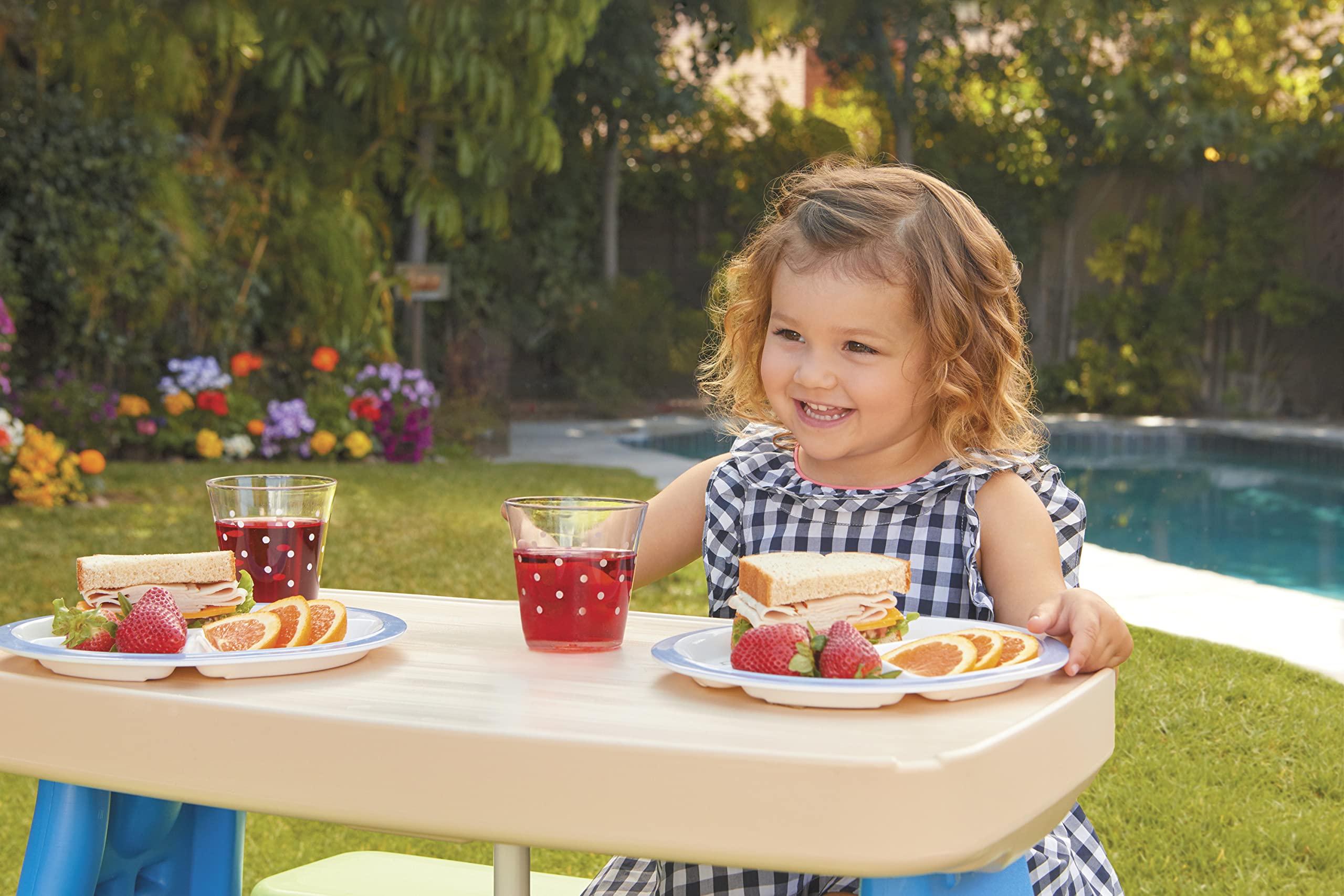 Little Tikes Easy Store Picnic Table features cup holders and a tray for snacks and crayons.